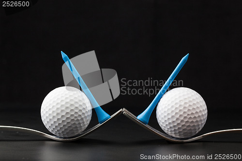 Image of Golf balls on the black background