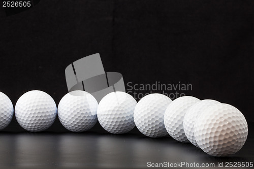 Image of Golf balls on the black background