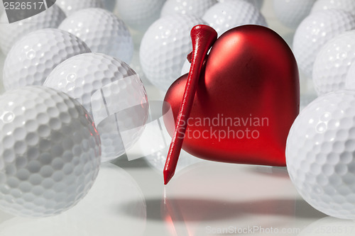 Image of Many golf balls and red heart 