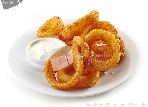 Image of onion rings and dip sauce