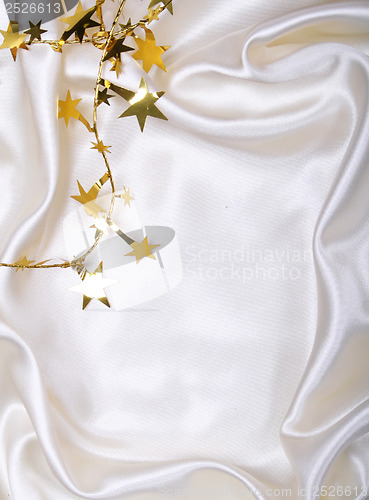 Image of Golden stars and spangles on white silk
