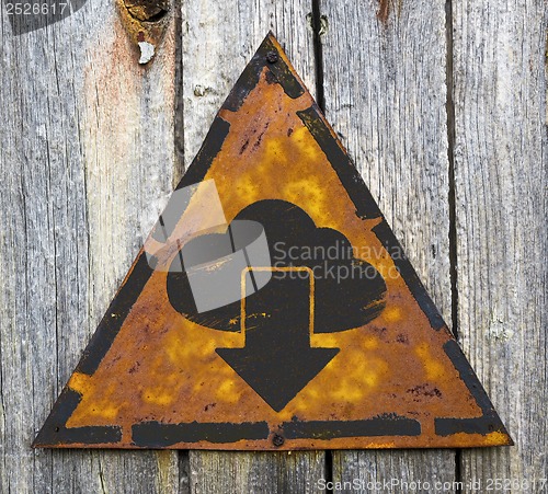 Image of Cloud with Arrow Icon on Rusty Warning Sign.