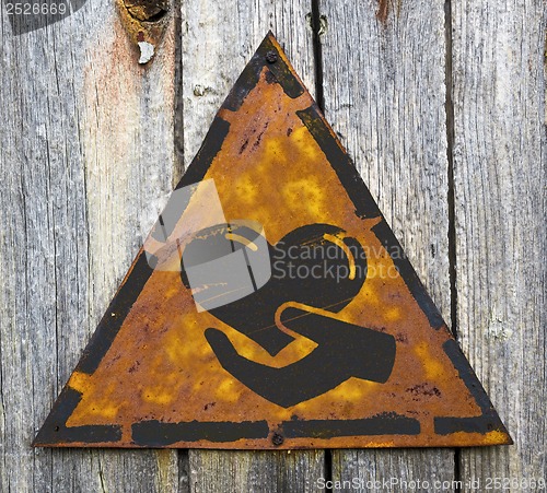 Image of Charity Concept on Weathered Warning Sign.