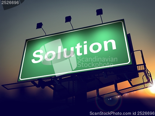 Image of Solution on Green Billboard at Sunrise.