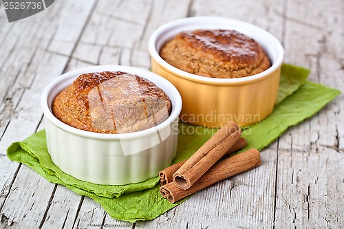 Image of two fresh baked buns and cinnamon sticks