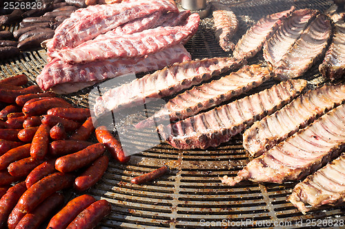 Image of Assorted meat being grilled