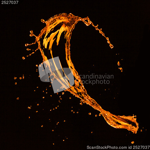 Image of orange water splash isolated on black