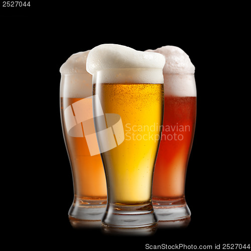 Image of Different beer in glasses isolated on black background