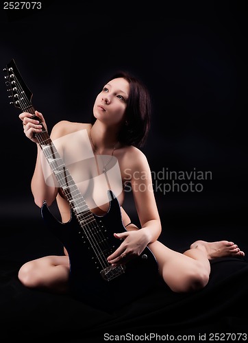 Image of sexy woman with guitar