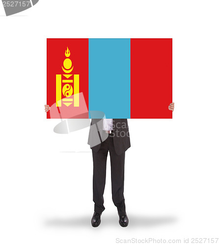 Image of Businessman holding a big card