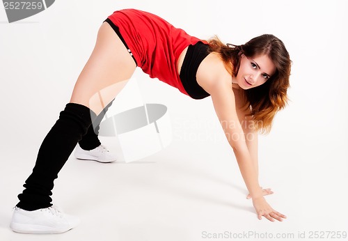 Image of young happy woman doing fitness exercise