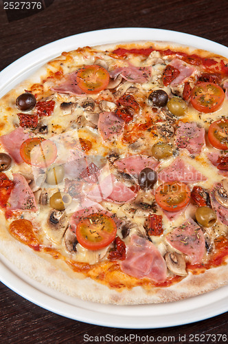 Image of pizza with ham and mushrooms