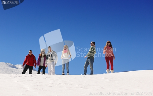 Image of friends have fun at winter on fresh snow