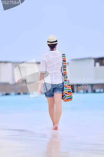 Image of beautiful woman on beach have fun and relax
