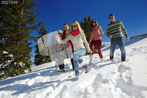 Image of friends have fun at winter on fresh snow