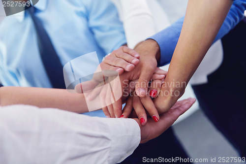 Image of business people group joining hands