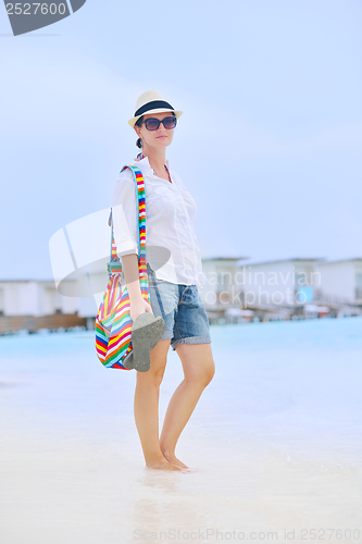 Image of beautiful woman on beach have fun and relax