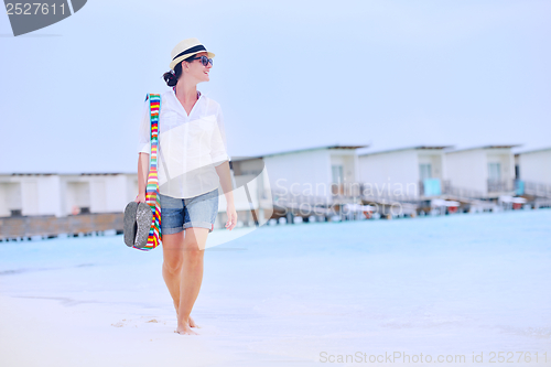 Image of beautiful woman on beach have fun and relax