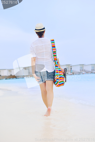 Image of beautiful woman on beach have fun and relax