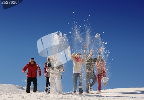 Image of friends have fun at winter on fresh snow