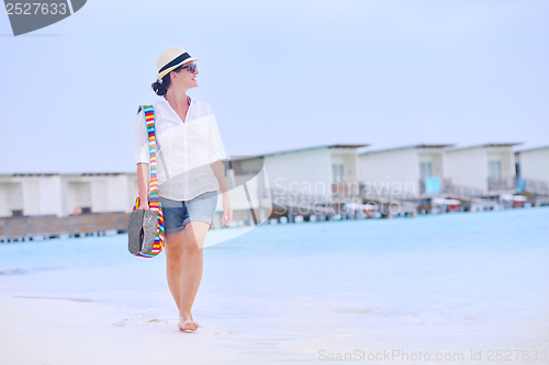 Image of beautiful woman on beach have fun and relax