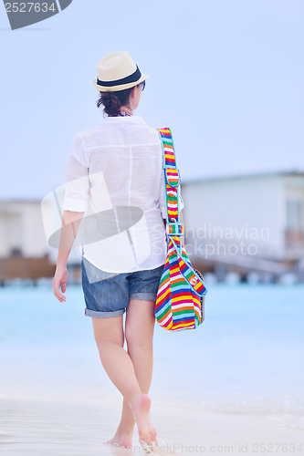 Image of beautiful woman on beach have fun and relax