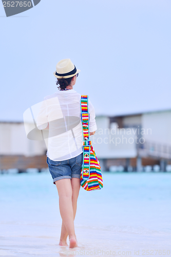Image of beautiful woman on beach have fun and relax