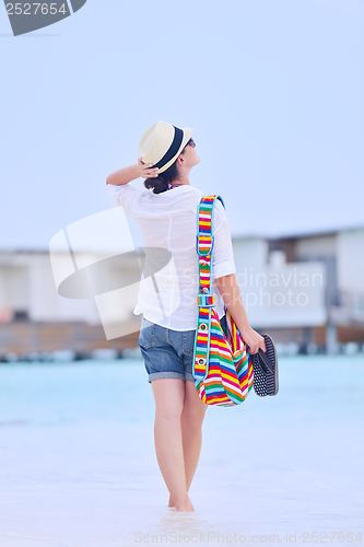 Image of beautiful woman on beach have fun and relax