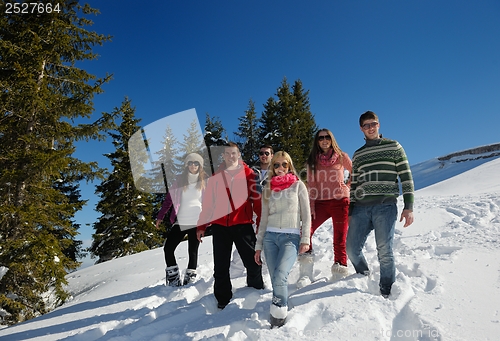 Image of friends have fun at winter on fresh snow
