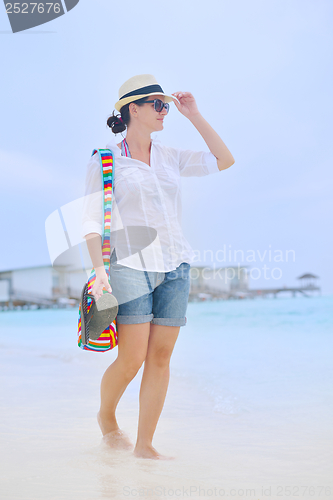 Image of beautiful woman on beach have fun and relax