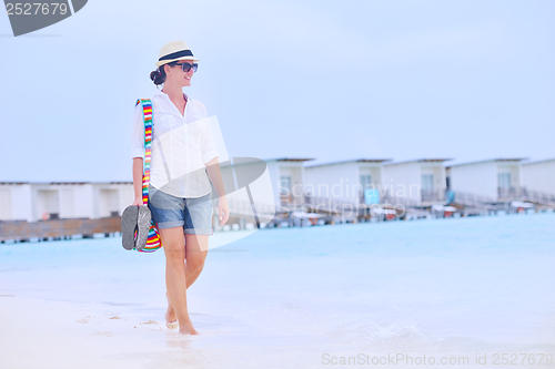 Image of beautiful woman on beach have fun and relax
