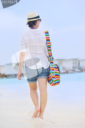 Image of beautiful woman on beach have fun and relax