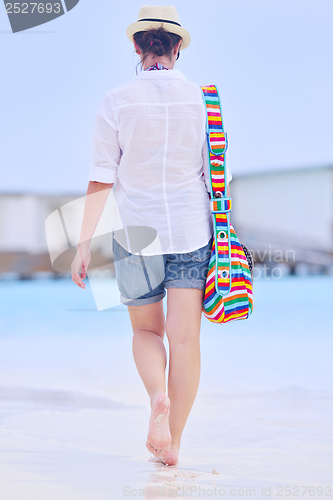 Image of beautiful woman on beach have fun and relax