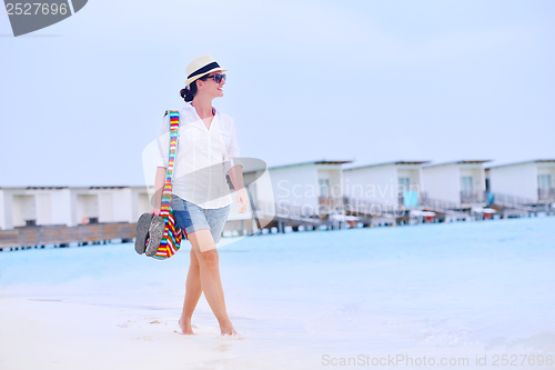 Image of beautiful woman on beach have fun and relax