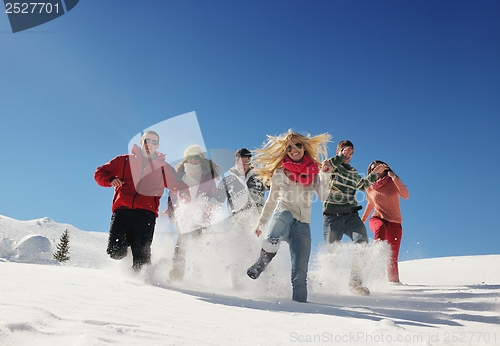 Image of friends have fun at winter on fresh snow