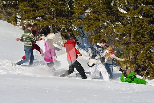 Image of friends have fun at winter on fresh snow