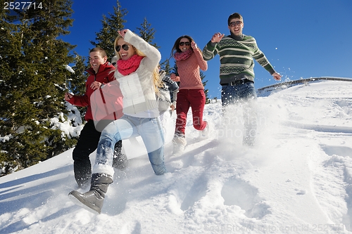 Image of friends have fun at winter on fresh snow