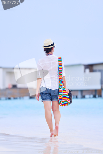 Image of beautiful woman on beach have fun and relax