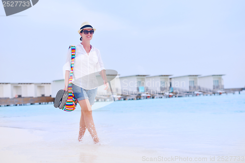 Image of beautiful woman on beach have fun and relax