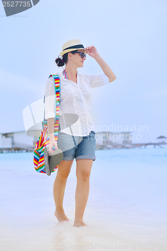 Image of beautiful woman on beach have fun and relax