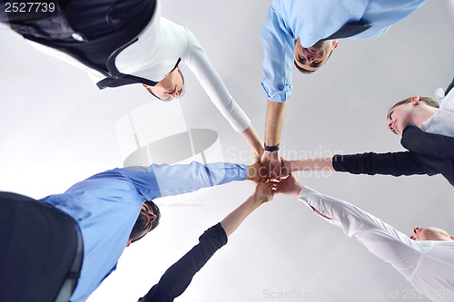 Image of business people group joining hands