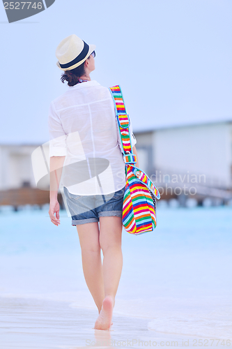 Image of beautiful woman on beach have fun and relax