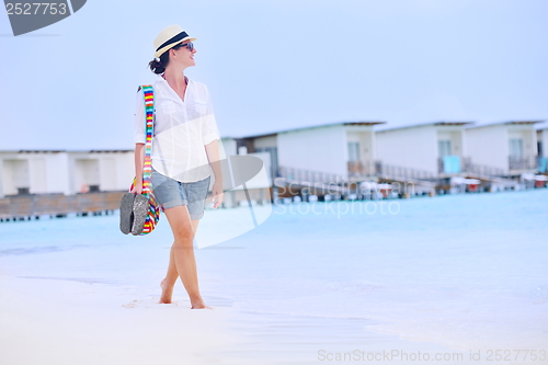 Image of beautiful woman on beach have fun and relax