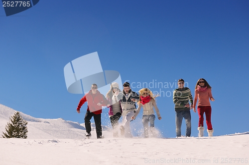 Image of friends have fun at winter on fresh snow