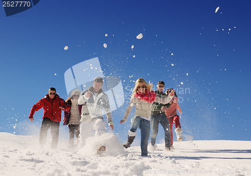 Image of friends have fun at winter on fresh snow