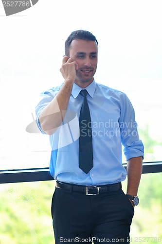 Image of business man using tablet compuer at office
