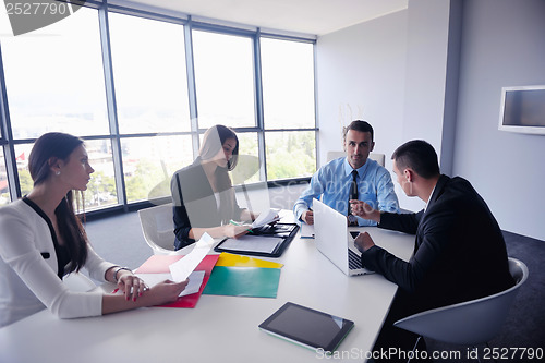 Image of business people group in a meeting at office
