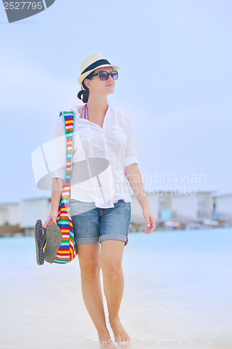 Image of beautiful woman on beach have fun and relax