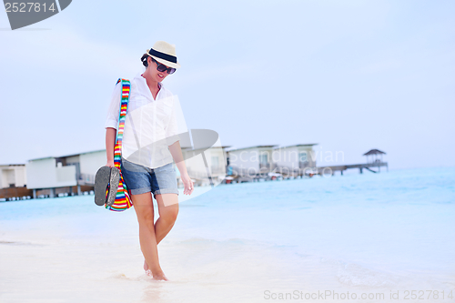 Image of beautiful woman on beach have fun and relax