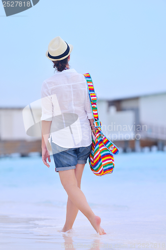 Image of beautiful woman on beach have fun and relax